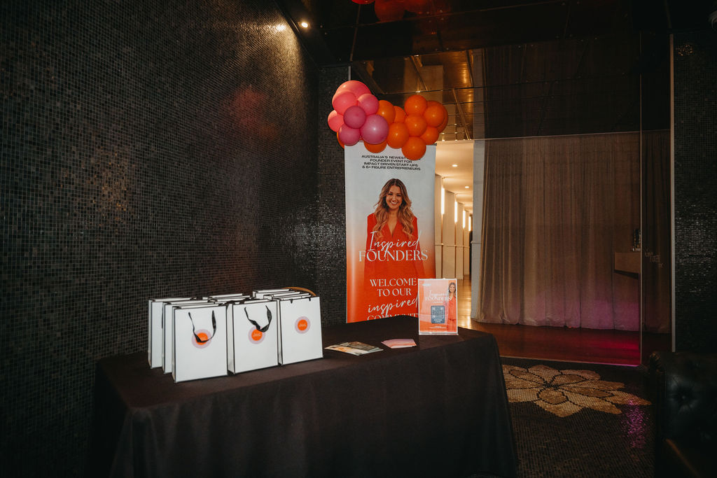 The Inspired Founders welcome desk with gift bags ready for arriving guests
