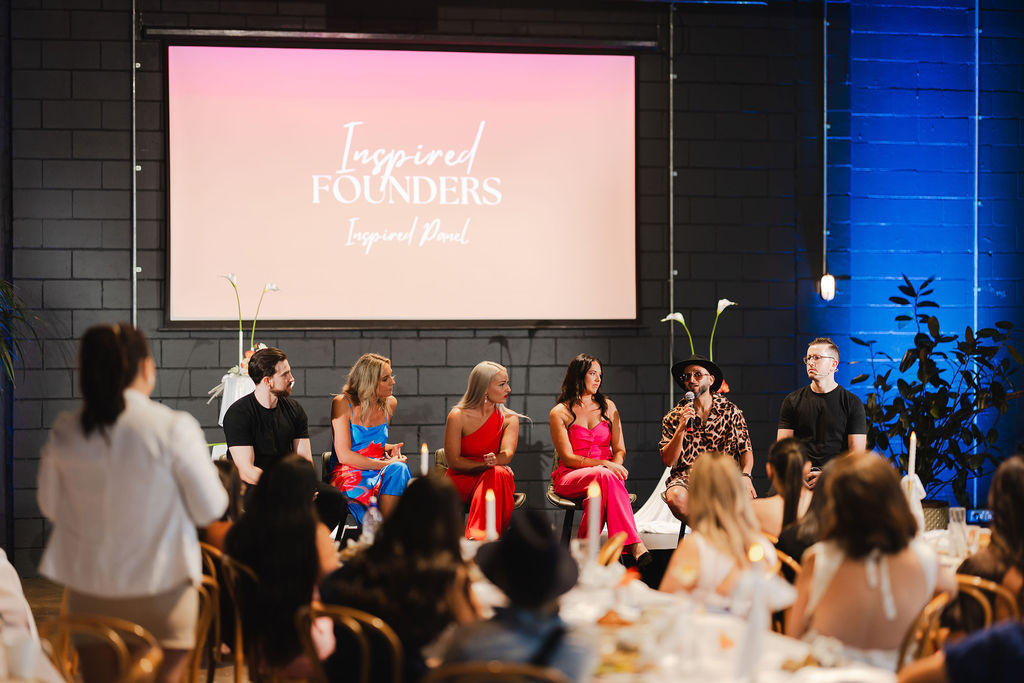 Five speakers seated together for an Inspired Founders panel conversation