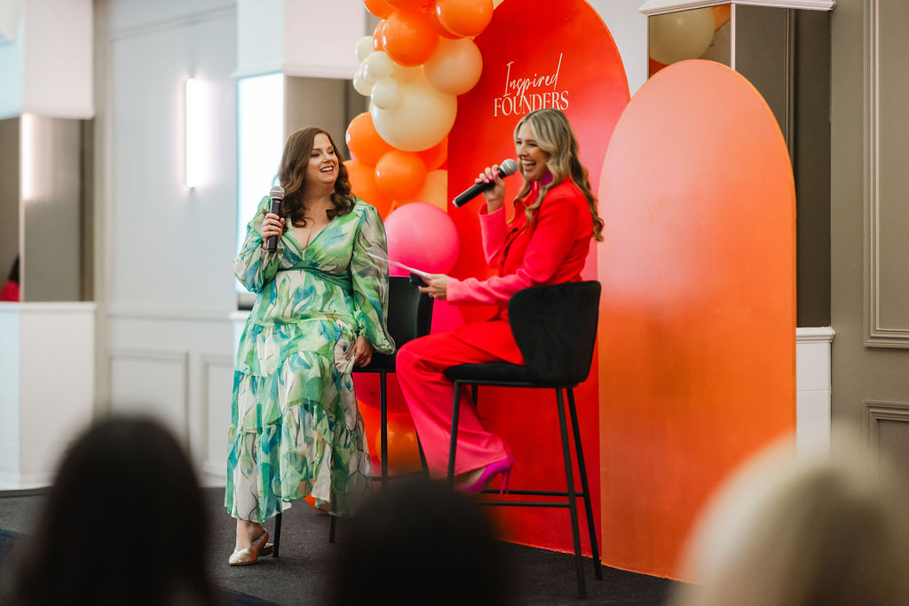 Two speakers sharing a conversation on the Inspired Founders stage